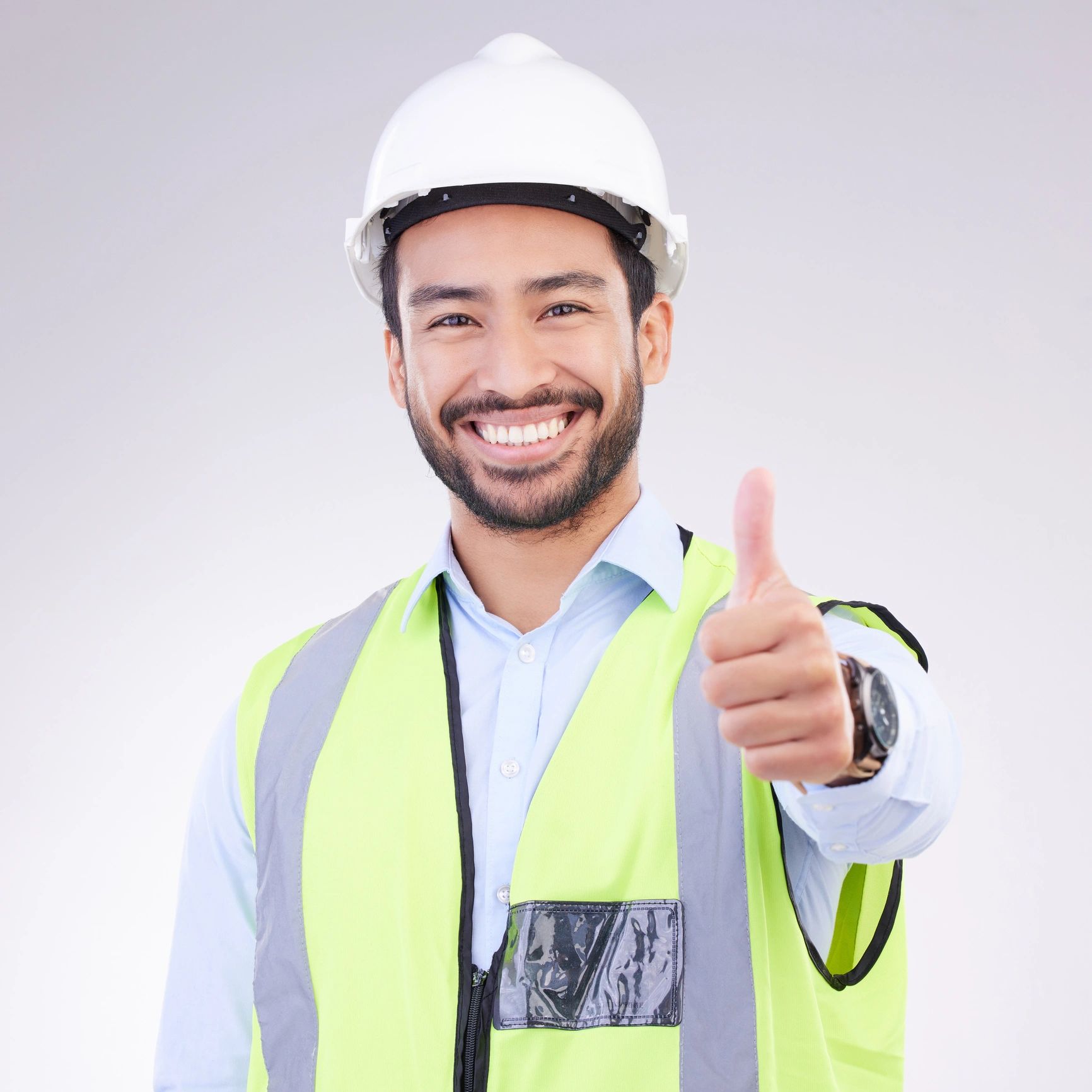 Professional portrait of a worker giving a thumbs-up