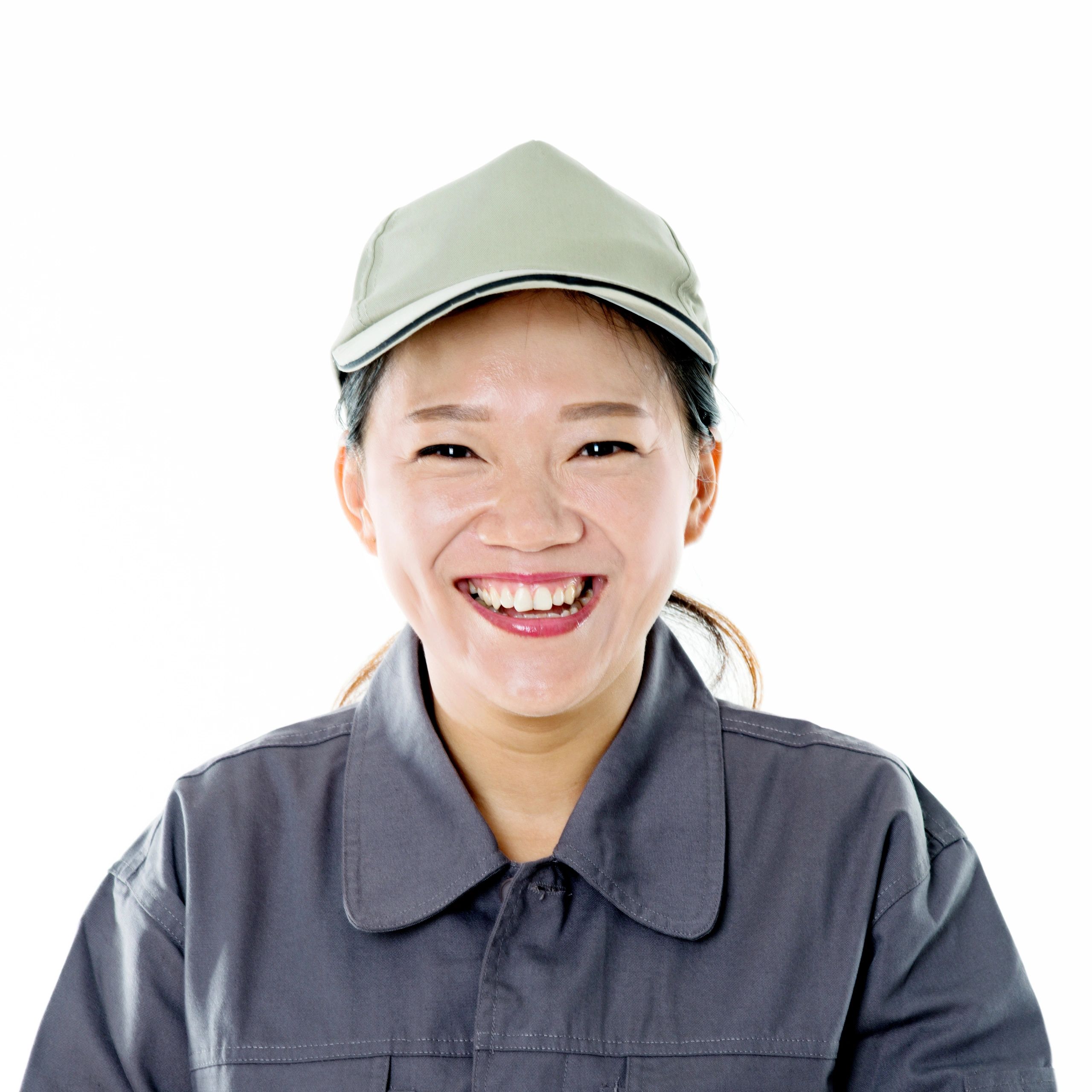 Smiling professional in a gray uniform